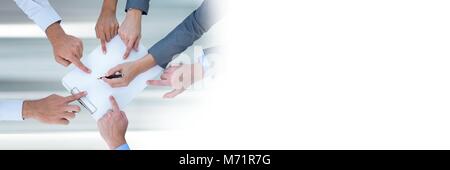 Teamwork transition with business people working and pointing hands on document Stock Photo