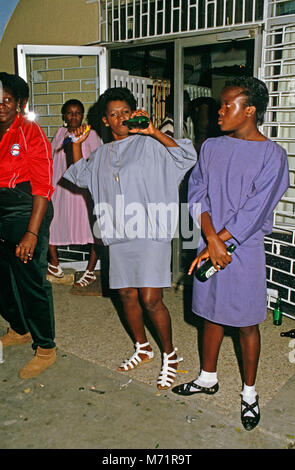 Women drinking at Half Way Tree Bar, Kingston, Jamaica Stock Photo