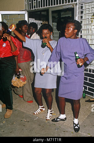 Women drinking at Half Way Tree Bar, Kingston, Jamaica Stock Photo