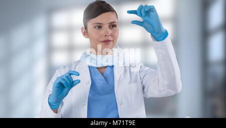 Female doctor interacting with air touch Stock Photo