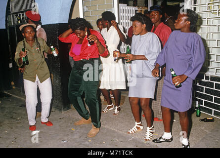 Women drinking at Half Way Tree Bar, Kingston, Jamaica Stock Photo