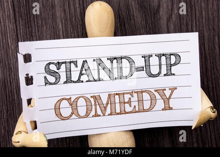 Word, writing, text  Stand Up Comedy. Conceptual photo Entertainment Club Fun Show Comedian Night written torn paper holding by sculpturethe wooden ba Stock Photo