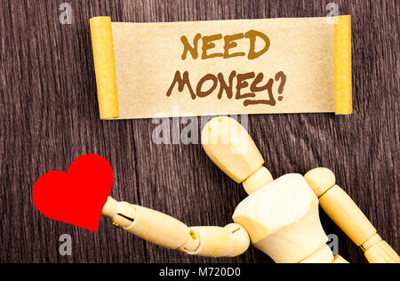 Text sign showing Need Money Question. Conceptual photo Economic Finance Crisis, Cash Loan Needed written Sticky Note Love Heart Holding By Sculpture  Stock Photo