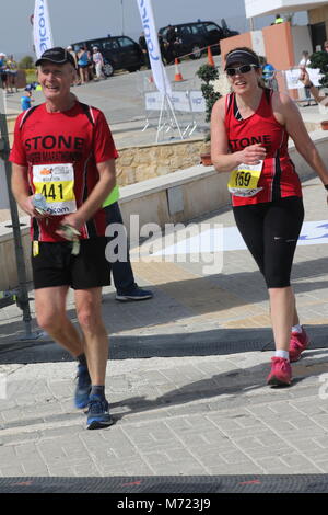 competitors nearing the end of the 20th Logicom Cyprus marathon, half marathon, 10KM, 5KM fun run, Paphos harbour near Paphos fort, Cyprus, Europe Stock Photo