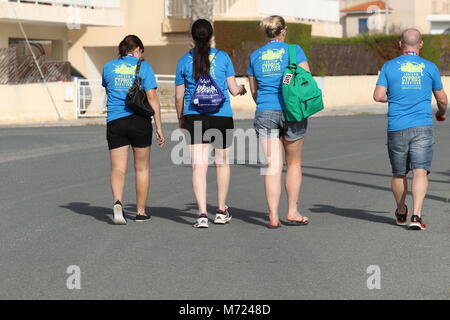 Four runners walking home after the 20th Logicom Cyprus marathon, half marathon, 10KM, 5KM fun run, Paphos, Cyprus, Europe Stock Photo