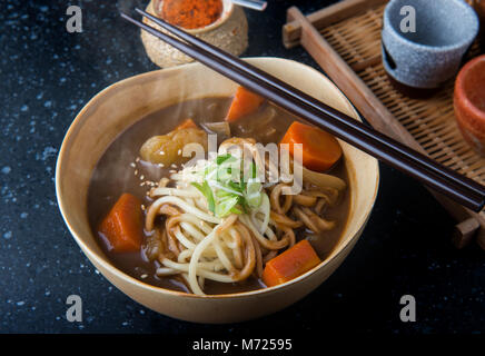 Japanese curry with udon noodle in bowl cup style ready to serve. Stock Photo