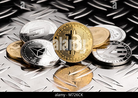 stack of  golden silver crypto currency coin on metal diamond steel plate financial black background bitcoin ethereum litecoin monero dash iota ripple Stock Photo