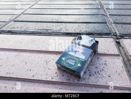 Health warning on discarded cigarette packet in Spain depicting a baby`s dummy with cigarette. Stock Photo