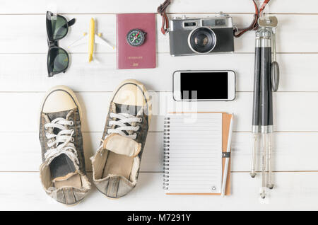 Travel plan, trip vacation, tourism mockup - Outfit of traveler on white wooden background. Flat lay. Stock Photo