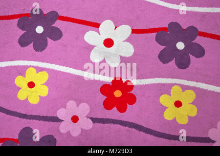 Purple flower carpet . Purple flower background . Kindergarten and child carpet Stock Photo