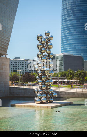 Bilbao, Spain - July 19, 2016 : under the summer sun, sculpture placed in front of the Guggenheim Museum named Tall Tree & The Eye, 2009 by Anish Kapo Stock Photo