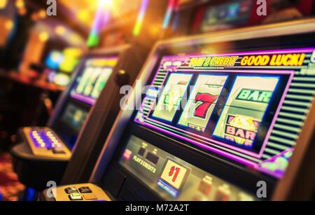 Casino Interior and Row of Classic Slot Machines. Las Vegas Gambling Theme. Stock Photo