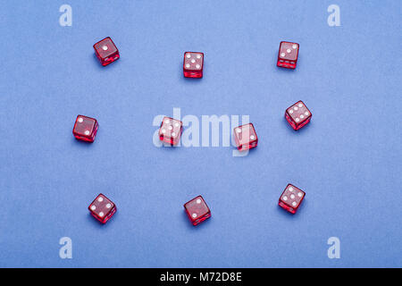 casino concept with red Dice on blue background. Stock Photo