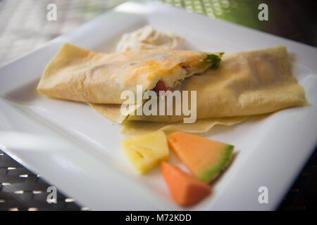 Breakfast Crepe filled With Eggs, spinach and cheese Stock Photo