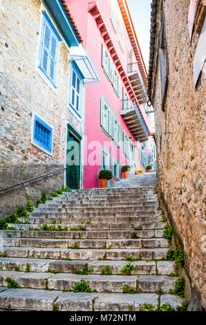 Narrow stone street and buildings in Nafplion city. Greece Stock Photo