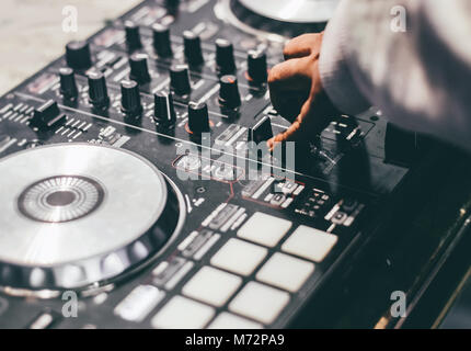 Dj playing music at mixer closeup Stock Photo