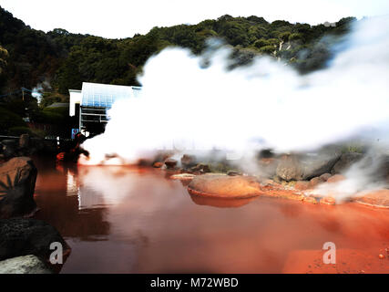 A small blood pond hot spring in the Umi Jigoku complex. Stock Photo