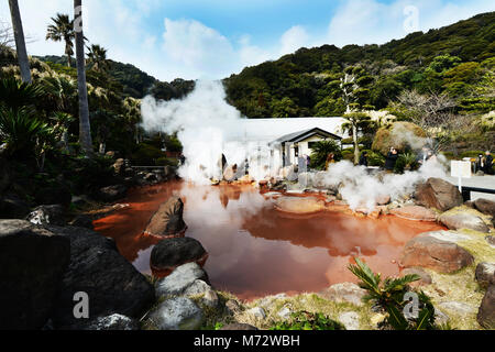 A small blood pond hot spring in the Umi Jigoku complex. Stock Photo