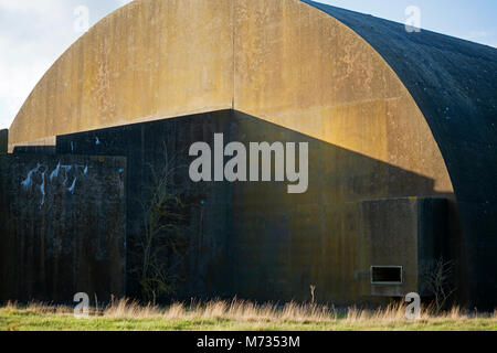 Hardened aircraft shelter at an abandoned Cold War airbase Stock Photo