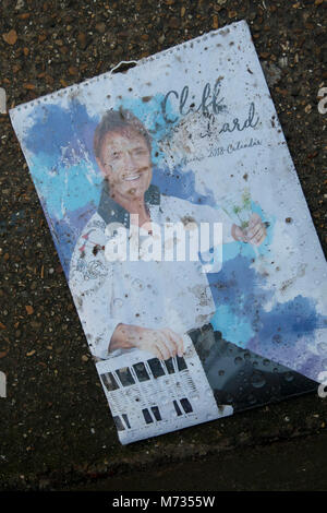 Discarded Sir Cliff Richard calendar in London, England, United Kingdom. Sir Cliff Richard OBE is a British pop singer, musician, performer, actor and philanthropist. Richard has sold more than 250 million records worldwide.