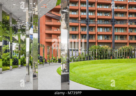 Gasholder Park (2013), on the Regent's Canal towpath is contained in the restored cast iron frame of King's Cross gasholder number 8, London, UK. Stock Photo