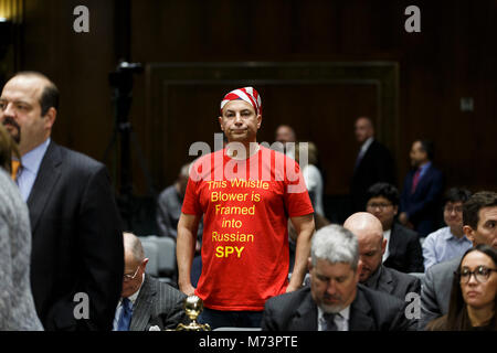 Washington, USA. 07th Mar, 2018. A demonstrator waits for a Senate Intelligence Committee Hearing on security clearance reform to begin on Capitol Hill in Washington, DC on March 7th, 2018. Credit: Alex Edelman/CNP -NO WIRE SERVICE- Credit: Alex Edelman/Consolidated News Photos/Alex Edelman - CNP/dpa/Alamy Live News Stock Photo