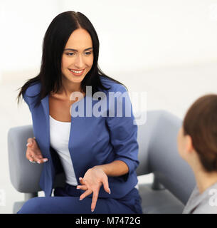 attractive business women meet in the office during a break Stock Photo