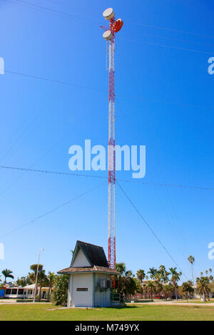 Communications mast in the center of Everglades City in South Florida USA Stock Photo