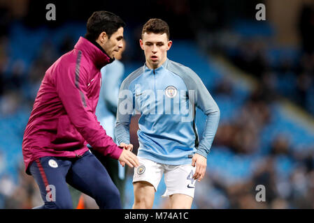 Manchester City's Phil Foden (right) and assistant coach Mikel Arteta (left) before the UEFA Champions League round of 16, second leg match at the Etihad Stadium, Manchester. PRESS ASSOCIATION Photo. Picture date: Wednesday March 7, 2018. See PA story soccer Man City. Photo credit should read: Martin Rickett/PA Wire Stock Photo