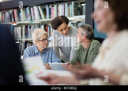 Seniors on computer skills course Stock Photo