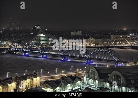 Riga city night lights drone flight winter Stock Photo
