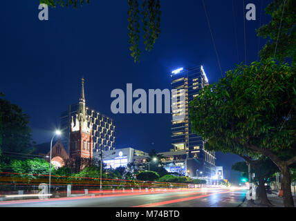 Yangon (Rangoon): Church of Holy Trinity, Junction City house and mall, Colonial Quarter, Yangon Region, Myanmar (Burma) Stock Photo