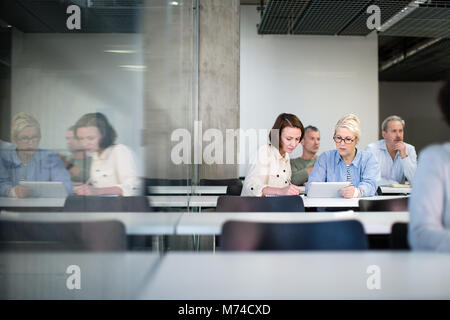 Female mature students working together on a course Stock Photo