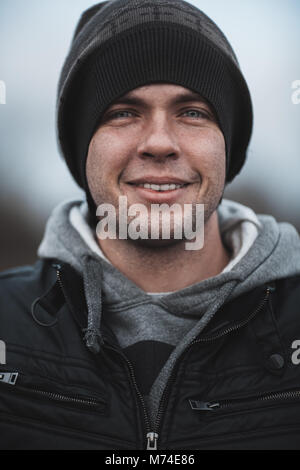 Nice man look in camera with cap in Prague Stock Photo