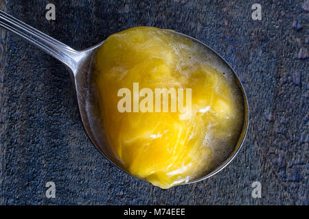 araza exotic fruit pulp from the Amazon area in spoon Stock Photo