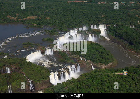 Iguazu Falls waterfalls high water border Brazil, Argentina UNESCO world heritage site, natural wonders of the World Aerial panorama scenic landscape Stock Photo