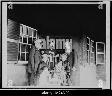 Alexander Graham Bell, his wife and daughters, with Mr. and Mrs. Alexander Melville Bell and Mr. and Mrs. Gardiner Greene Hubbard on porch at Manchester-by-the-Sea LCCN00650250 Stock Photo