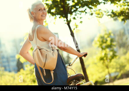 Nice delighted woman being outdoors Stock Photo