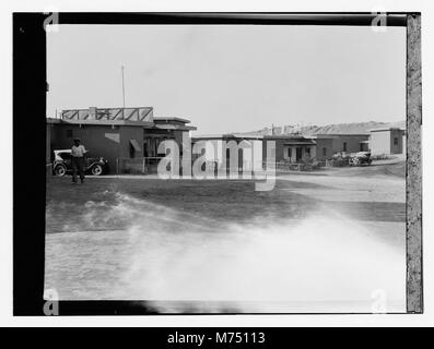 Iraq, housing & man in western dress in car LOC matpc.13219 Stock Photo