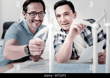Two smiling colleagues discussing new project Stock Photo