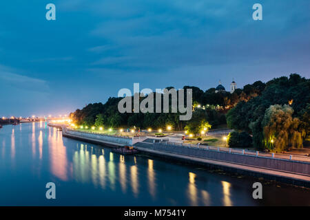 Beautiful views of the waterfront city of Gomel in the night illumination and reflection in the river Sozh Stock Photo