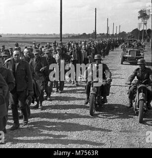 1939 WW2 Polish prisoners of war escorted by German soldiers near Lviv/Lwow during German invasion of Poland. Stock Photo