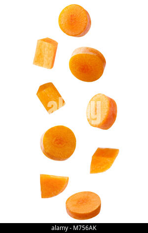 Isolated falling vegetables. Falling carrot isolated on white background with clipping path as package design element. Stock Photo