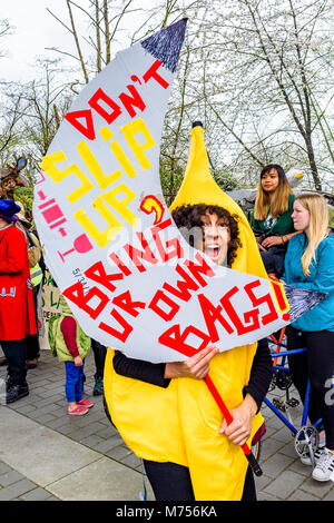 Woman with Plastic awareness costume and sign, Earth Day Parade and Festival, Vancouver, British Columbia, Canada Stock Photo