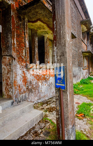 Abandoned building and toilet sign at Bokor mountain, Kampot, Cambodia Stock Photo