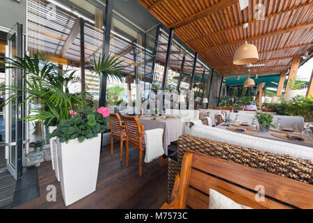 MOSCOW - JULY 2014: Interior of the modern Azerbaijani cuisine ethnic restaurants - 'BARASHKA'. Veranda in the open air at the entrance to the restaur Stock Photo