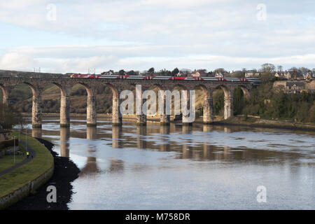 Virgin electric express passenger train passing over the Royal Border Bridge, Berwick upon Tweed, Northumberland, England, UK Stock Photo