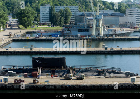 Polish Project 877E (Kilo-class by NATO) submarine ORP Orzel 291 and Polish Offshore Patrol Vessel ORP Slazak in Polish Navy Shipyard in Gdynia, Polan Stock Photo