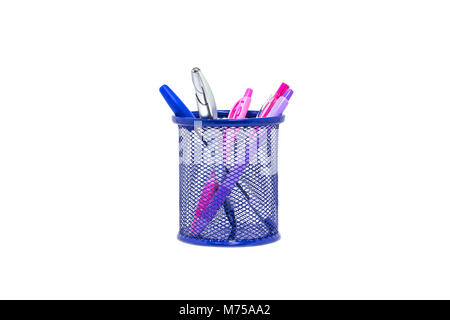 Violet and blue pens in dark blue metal vase isolated on white background Stock Photo
