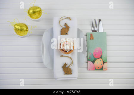 colorful Easter table place setting on white Stock Photo